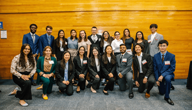 A group of business people posing for a photo.