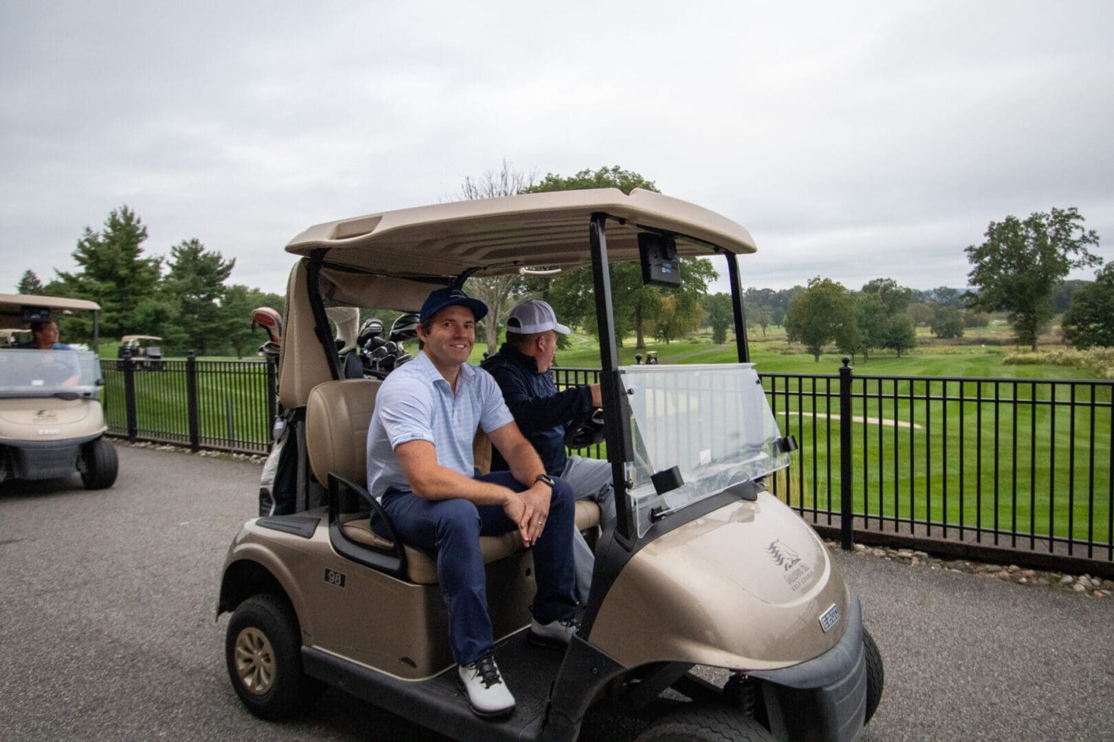 2 men exploring on a golf cart