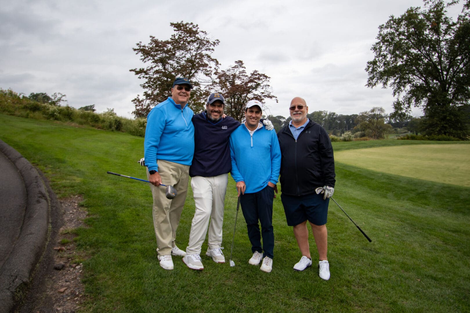 4 men in a golf course