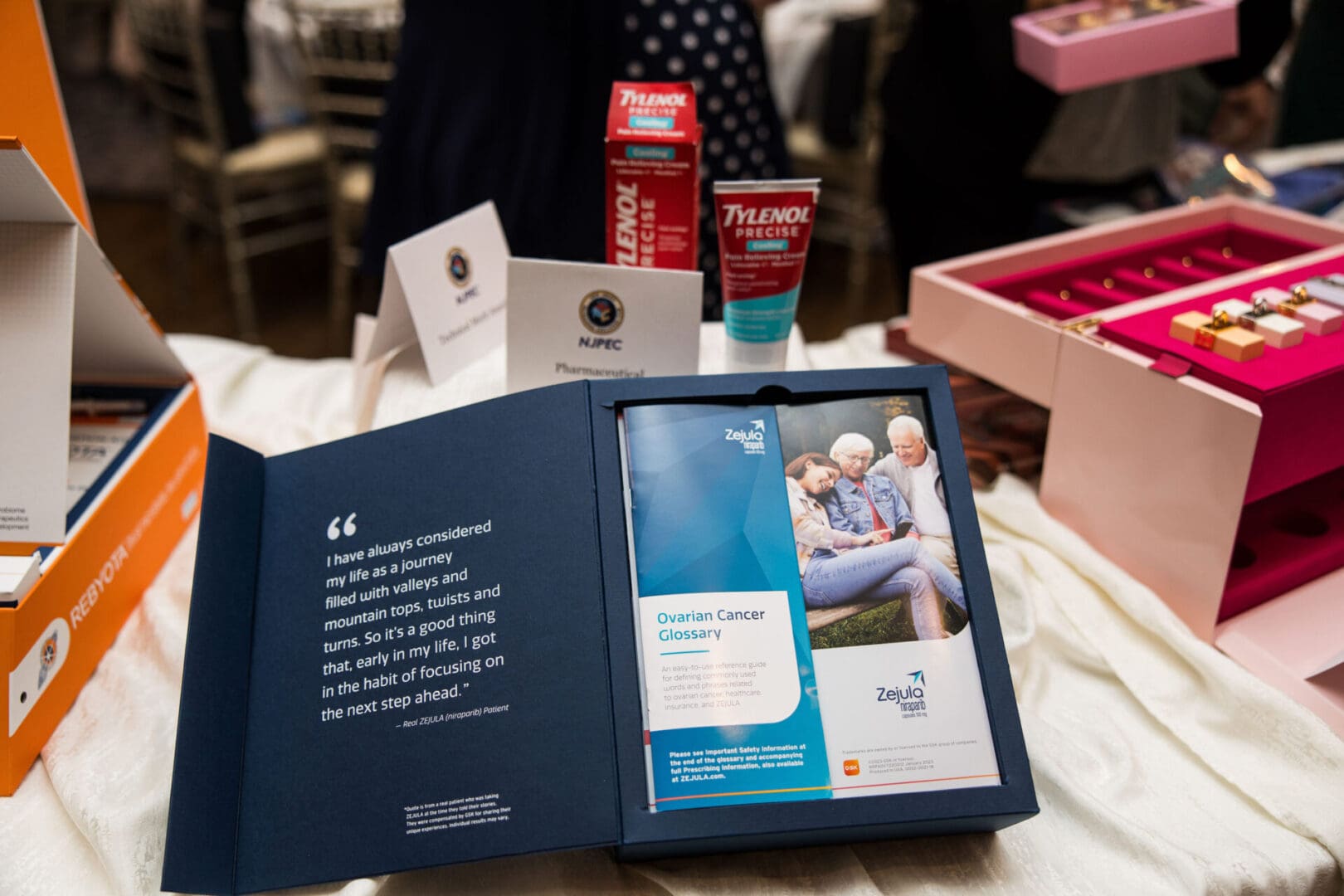 A box of products on a table at an event.