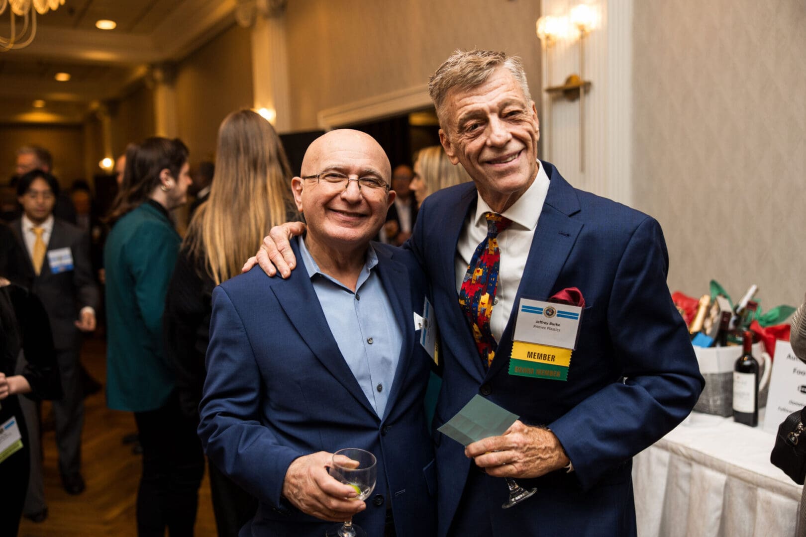 Two men posing for a photo at an event.