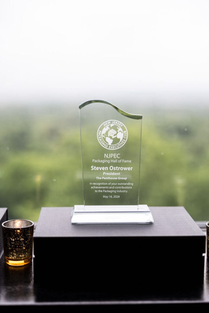 An award on a table with a green background.
